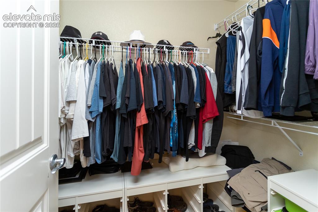 Image 21 of 49: Primary suite offers a spacious walk-in closet.