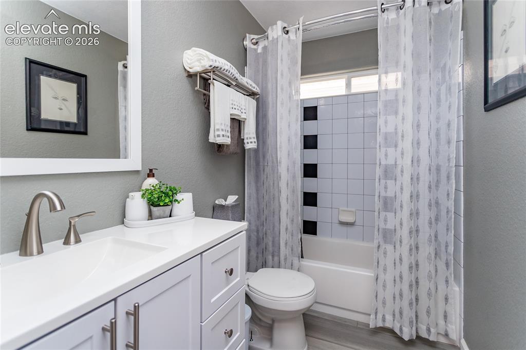 Image 24 of 49: Hall bathroom on the main level is located next to the 2nd bedroom on the m