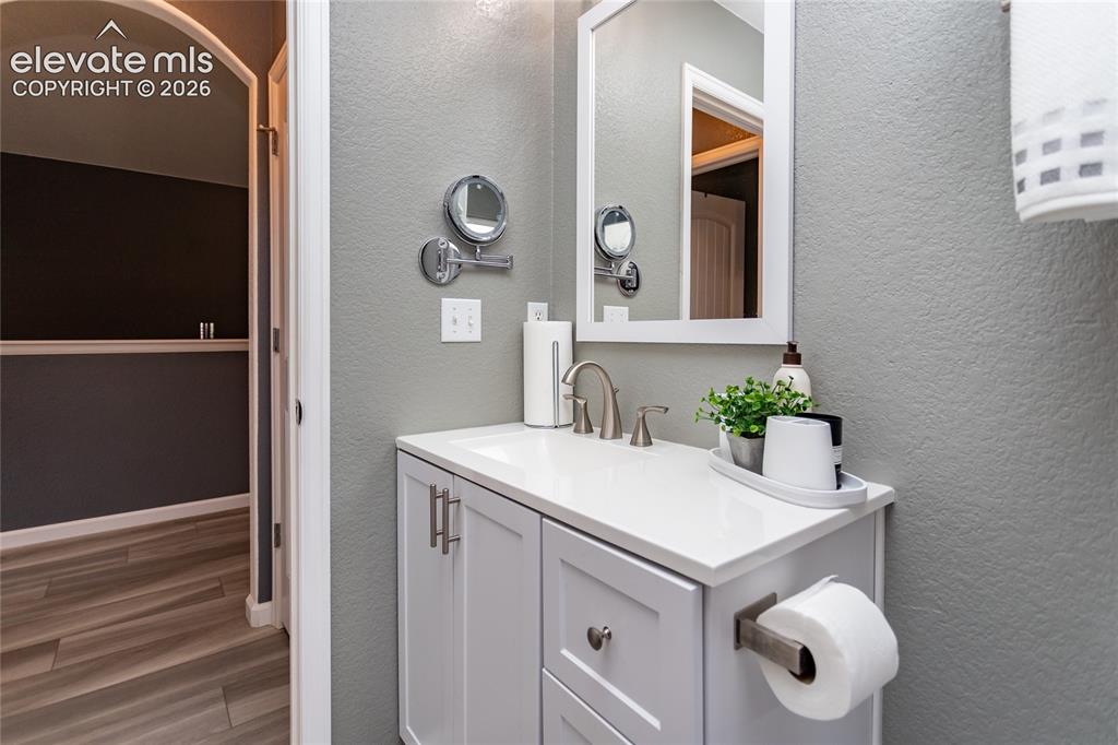 Image 26 of 49: Hall bathroom on the main level is nicely remodeled.