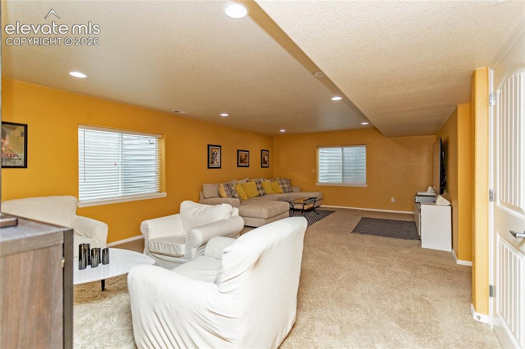 Image 29 of 49: Rec room offers comfortable living and entertaining space.