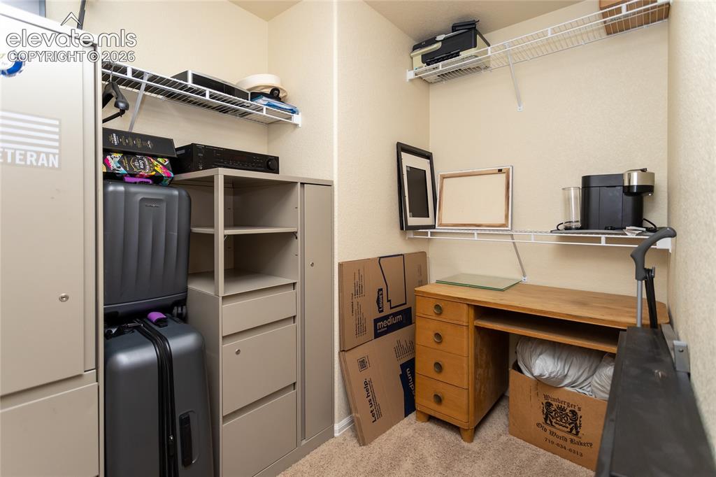 Image 37 of 49: Walk-in closet of bedroom 3 is currently used as storage.