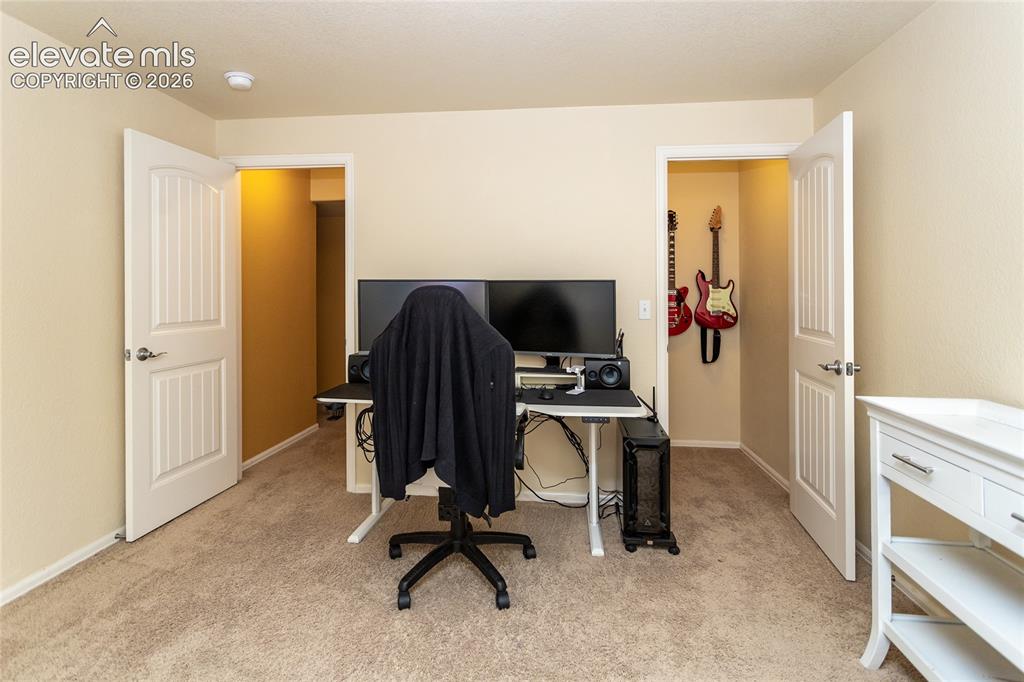 Image 39 of 49: Bedroom 4 in the basement has a large walk-in closet.