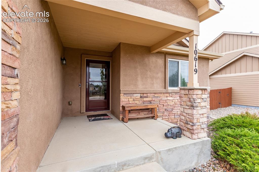 Image 4 of 49: Covered front porch welcomes you in.