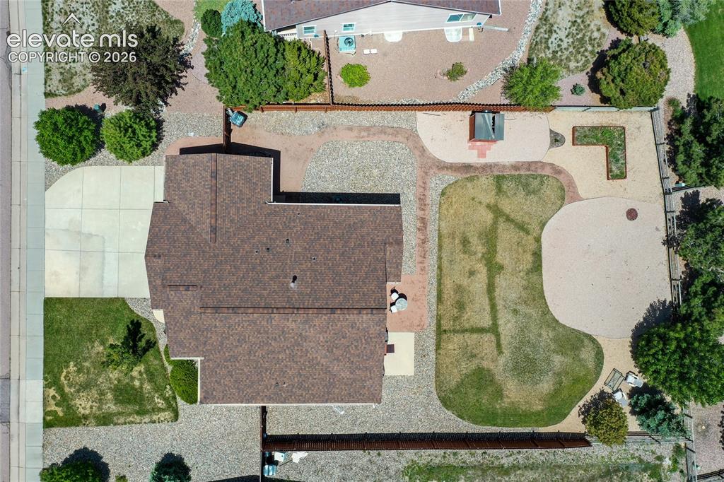 Image 46 of 49: Beautiful landscaping includes sprinkler and drip system.