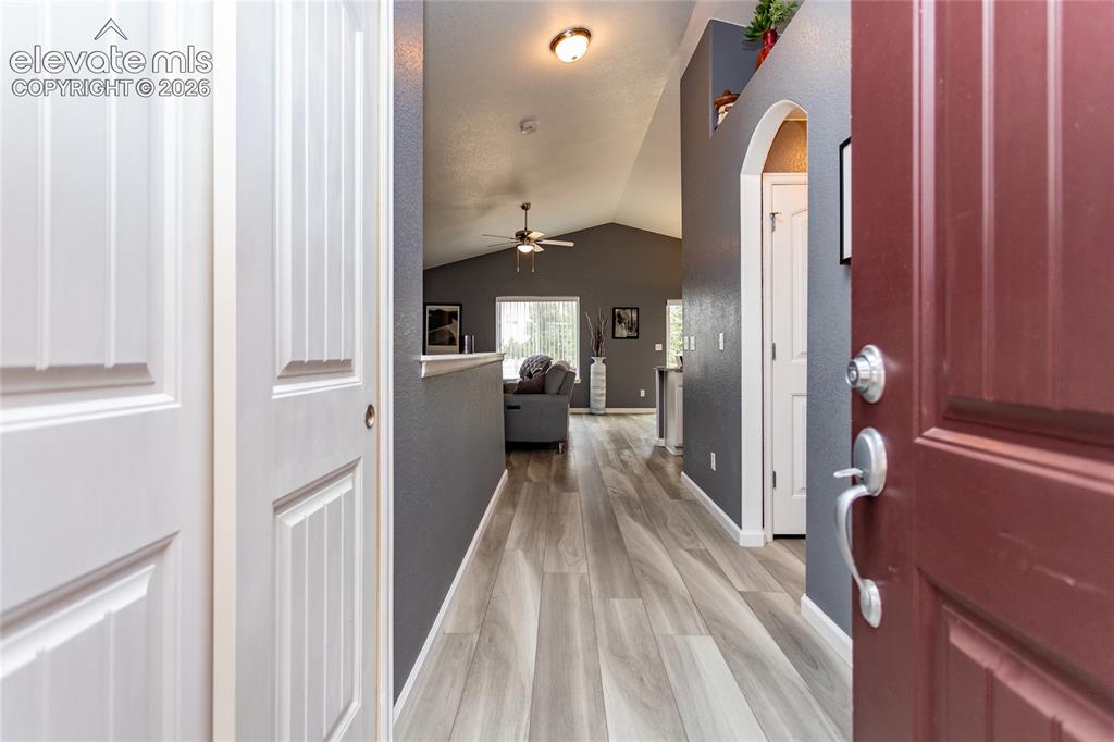 Image 5 of 49: Gorgeous LVP flooring extends through the main level living areas.
