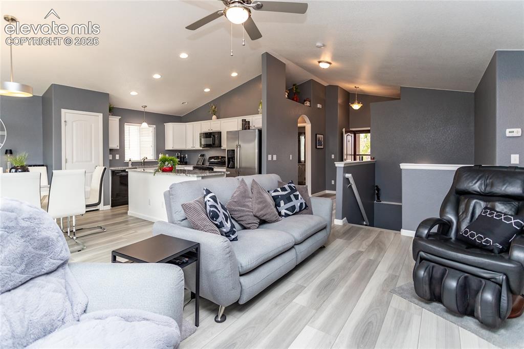 Image 8 of 49: Comfortable and roomy living space blends in with the kitchen and dining ar