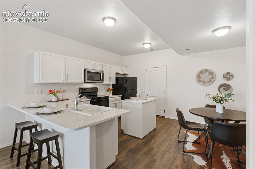 Image 10 of 38: Whip up your favorite meals with ease using the abundant counter space and