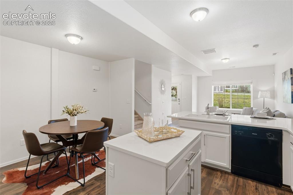 Image 12 of 38: Host dinner parties in this spacious eat-in kitchen that comfortably fits a