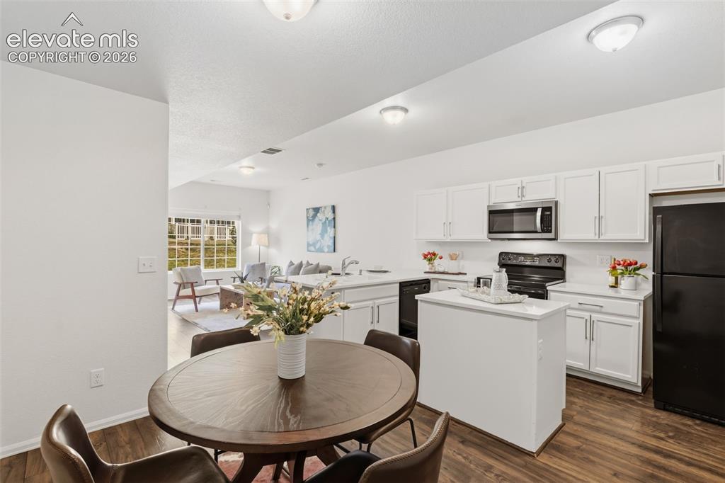 Image 13 of 38: The open floor plan provides plenty of room for a dining setup to bring eve