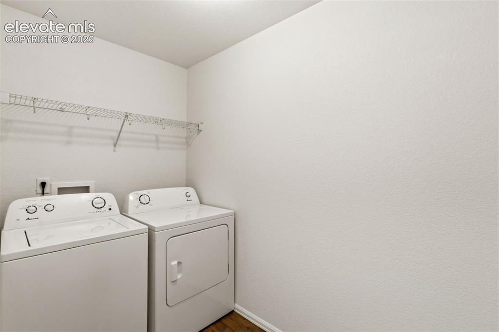Image 17 of 38: Take the chore out of laundry day with this generously sized upper-level la