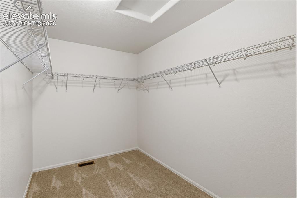 Image 25 of 38: Organize your wardrobe perfectly in the primary suite