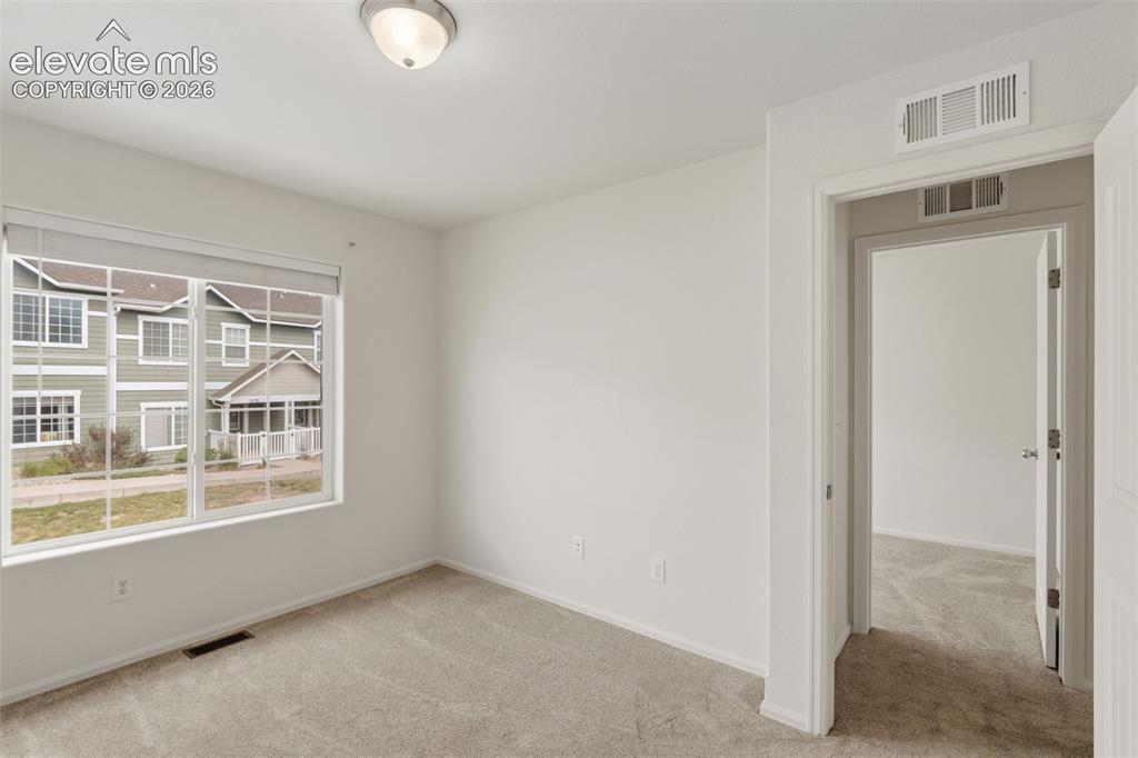 Image 29 of 38: Large vinyl windows let in great natural light, making this upper-level roo