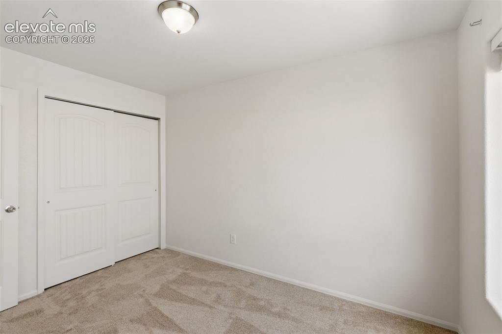 Image 31 of 38: The third bedroom also includes great closet space and offers a blank slate