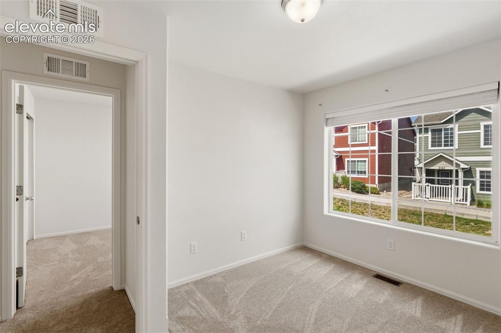 Image 33 of 38: Located on the upper level alongside the primary suite, this room is perfec