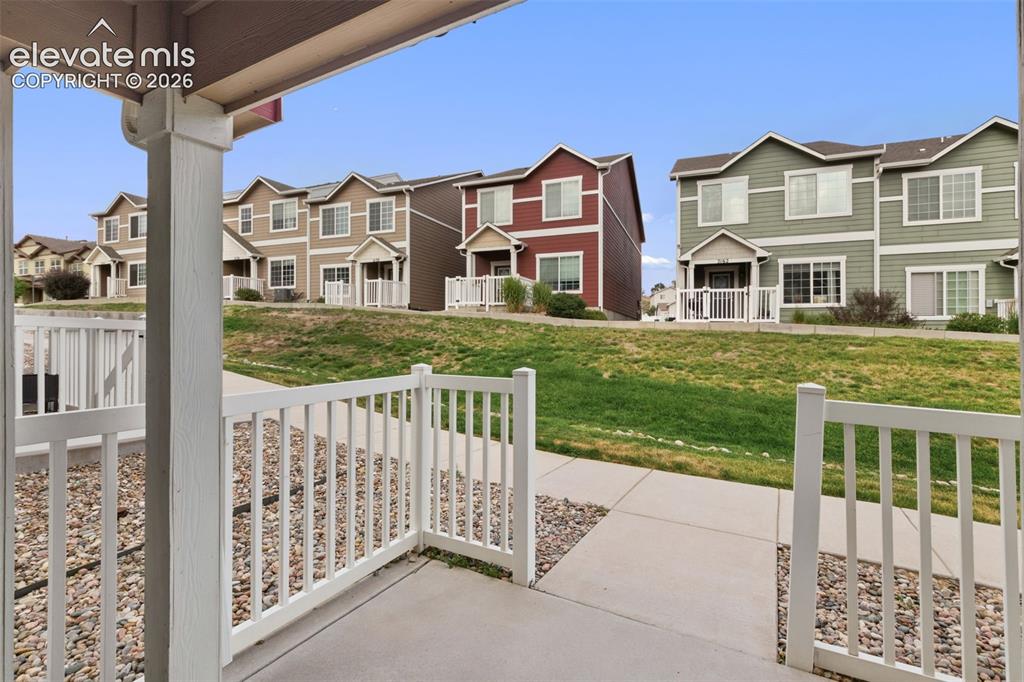 Image 4 of 38: Relax on your covered front porch with the peace of mind that comes from an