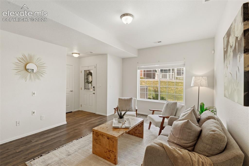 Image 5 of 38: Step inside the living room to find an inviting, open main level perfect fo