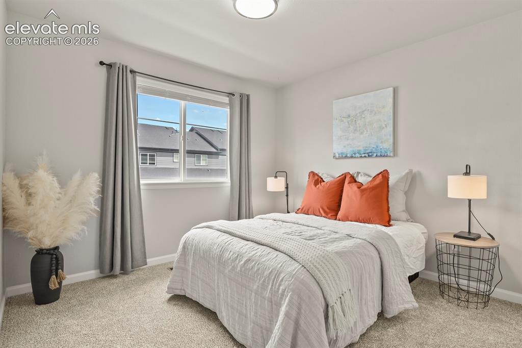Image 25 of 29: Recessed window with light gray curtains, light gray walls, light beige car