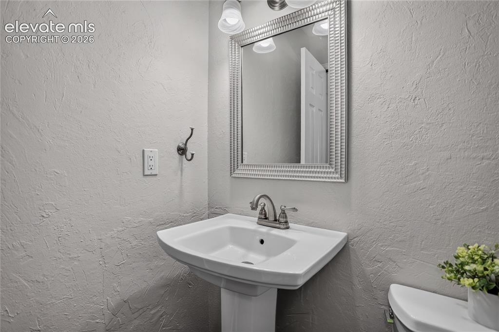 Image 10 of 30: Main level powder room