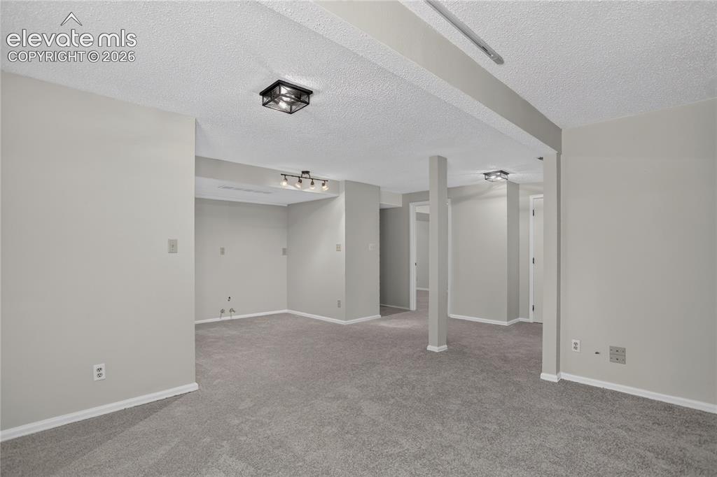 Image 19 of 30: Family room extend indoor entertainment space