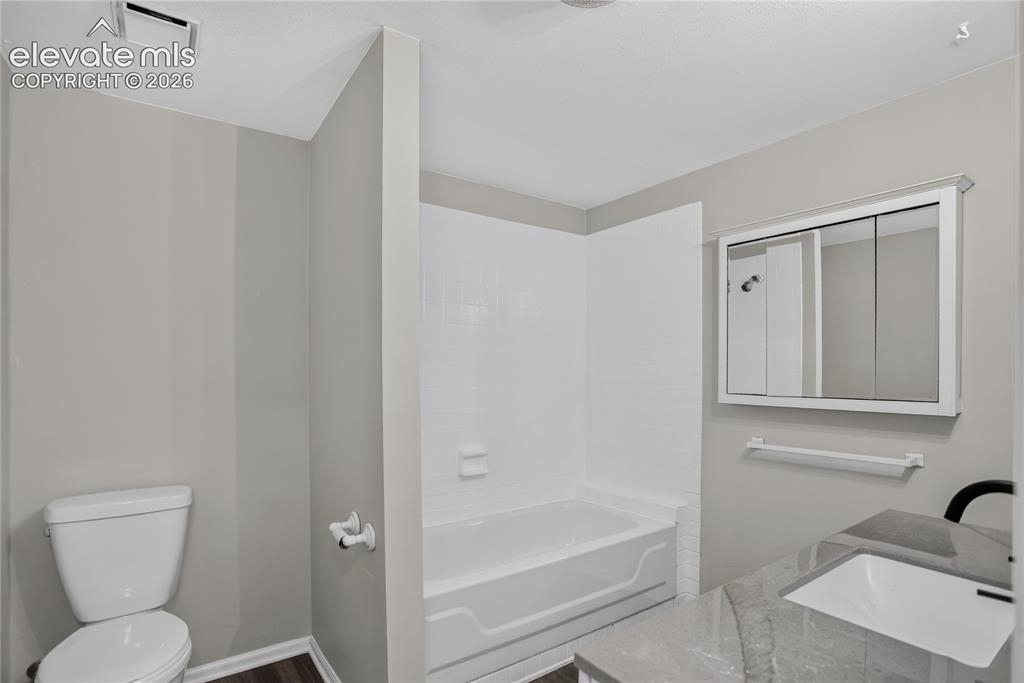 Image 22 of 30: Full guest bath - lower level