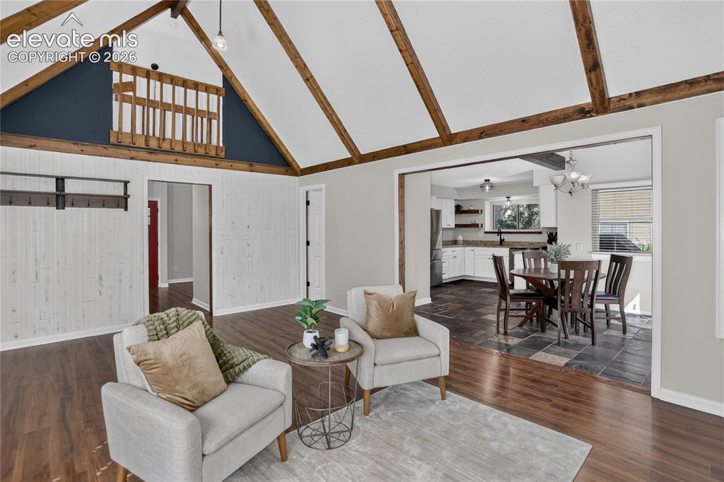 Image 4 of 30: Main living room w/ vaulted ceiling