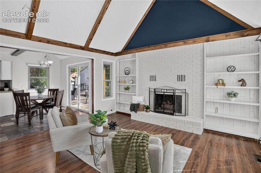 Image 5 of 30: Built-in shelving & fireplace