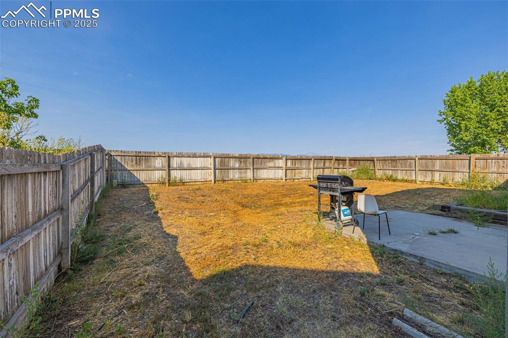 Image 20 of 30: Fenced backyard featuring a patio area