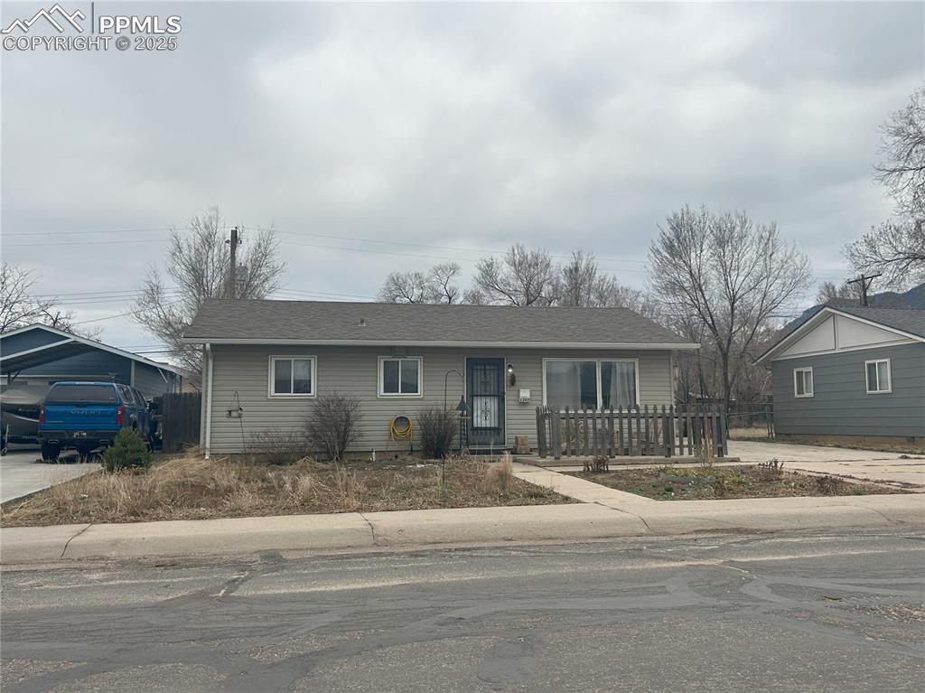 Image 14 of 16: Single story home with a shingled roof