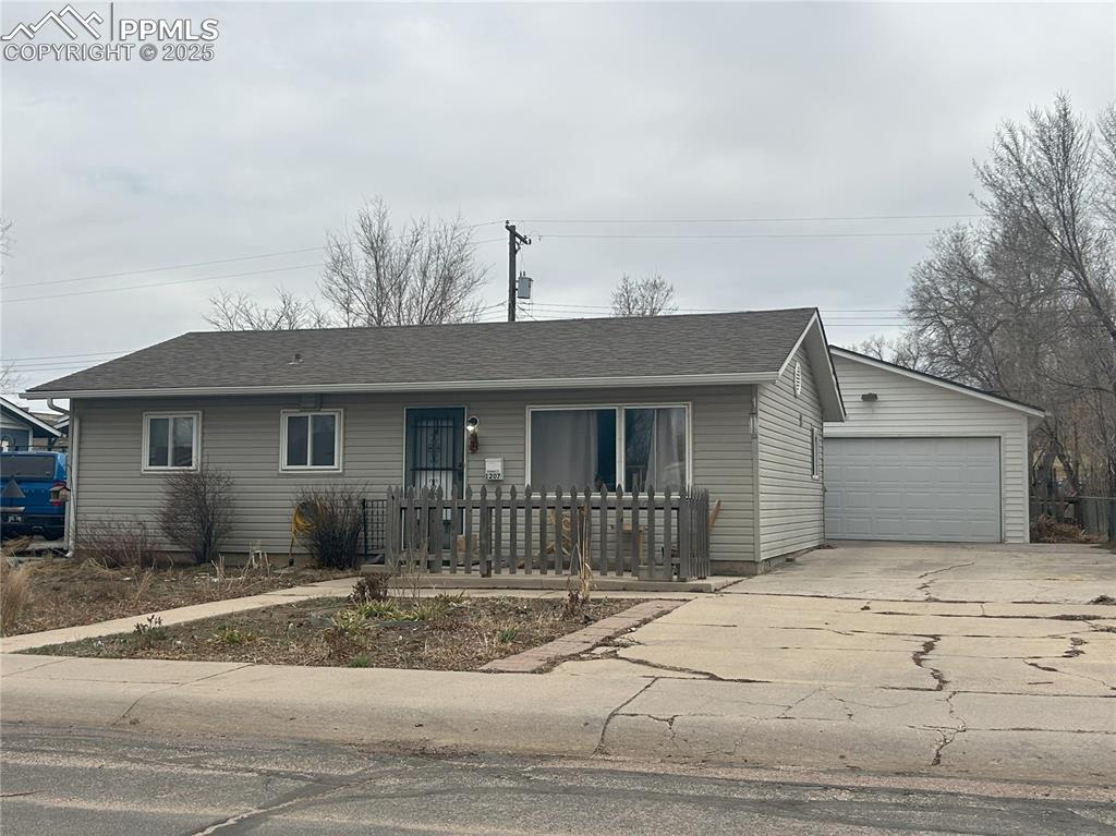 Image 15 of 16: Single story home with a garage and roof with shingles