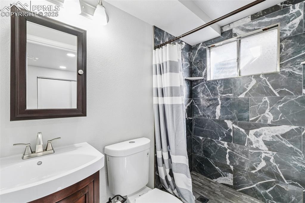 Image 34 of 43: Remodeled Basement Bathroom Attached To Non-Conforming Bedroom #4