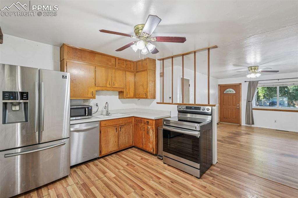 Image 8 of 43: Kitchen Looking Into Living Room