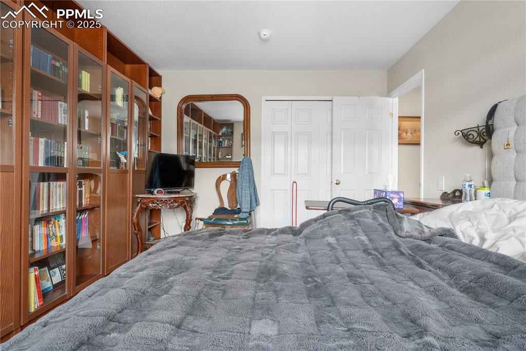 Image 11 of 38: Bedroom with a closet