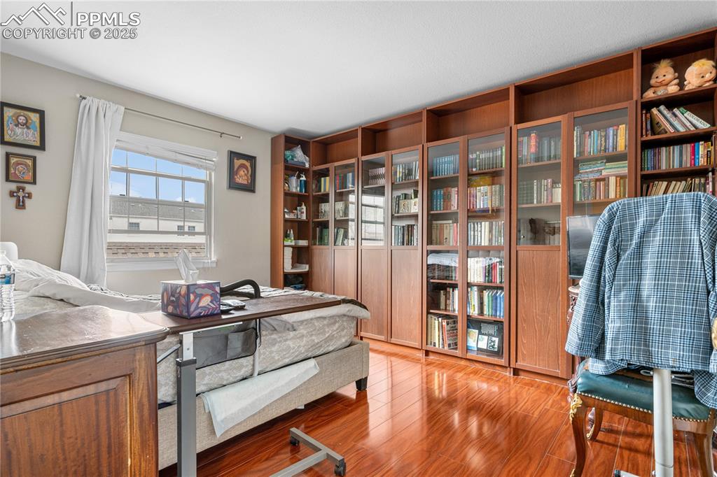 Image 12 of 38: Home office with light wood-style floors