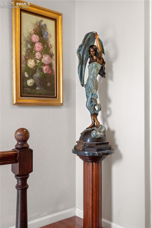 Image 17 of 38: Detailed view of baseboards and wood finished floors
