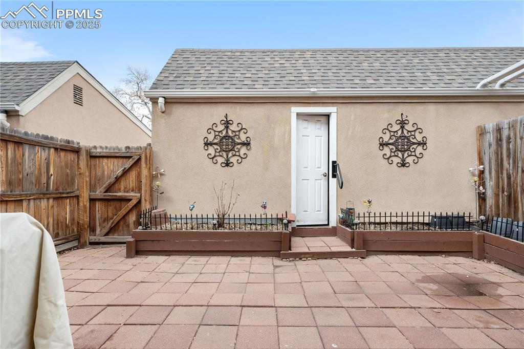 Image 22 of 38: View of patio / terrace with a gate