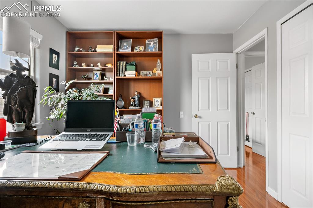 Image 9 of 38: Office with wood finished floors