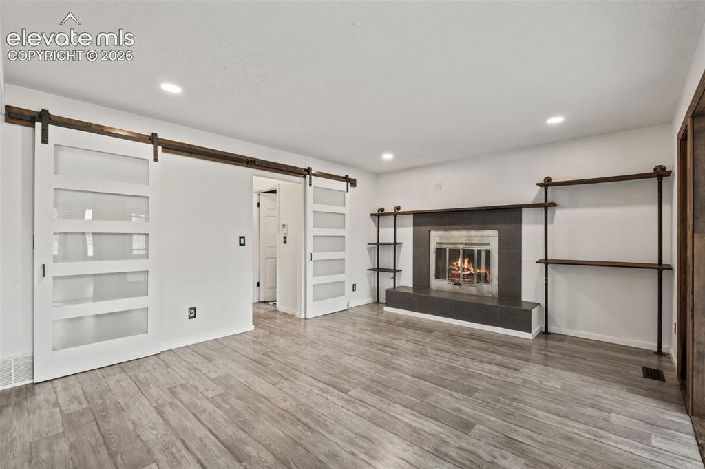Image 13 of 50: Family Room with Fireplace