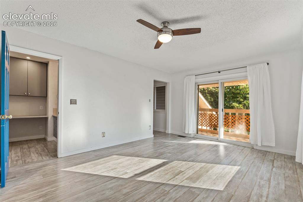 Image 20 of 50: Primary Bedroom with Adjoining Bath, Walk-In Closet and Balcony