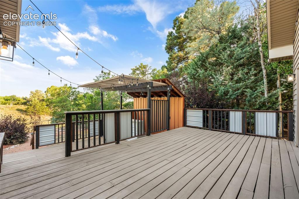 Image 37 of 50: MultiLevel Deck with Bar
