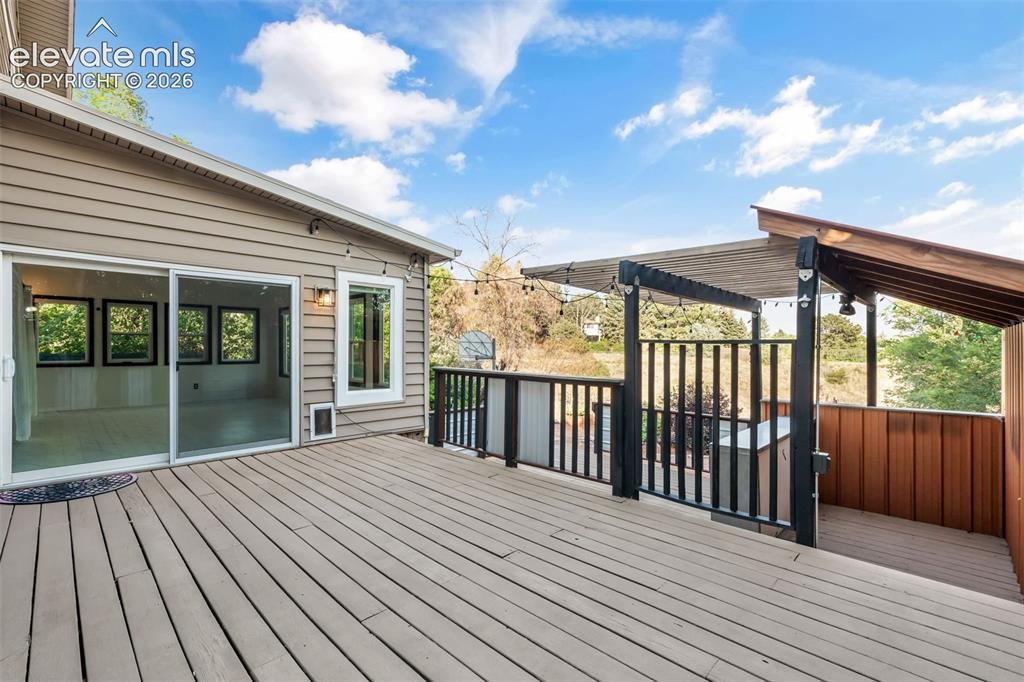 Image 38 of 50: MultiLevel Deck with Bar