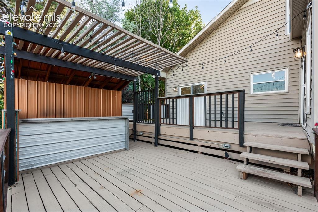 Image 39 of 50: MultiLevel Deck with Bar
