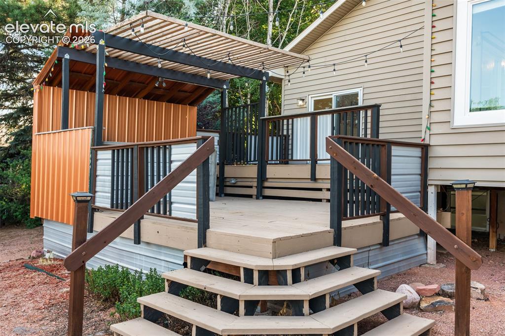Image 40 of 50: MultiLevel Deck with Bar