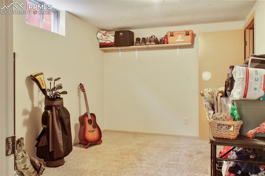 Image 17 of 28: Recreation room featuring carpet floors and baseboards