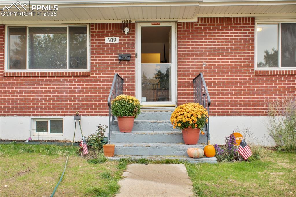 Image 2 of 28: View of exterior entry featuring brick siding