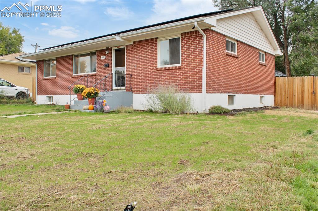Image 27 of 28: Ranch-style home with brick siding