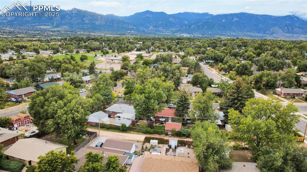 Image 4 of 28: Aerial perspective of suburban area featuring mountains