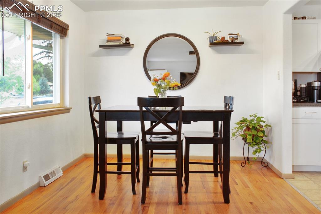 Image 6 of 28: Dining room featuring light wood-style flooring and baseboards