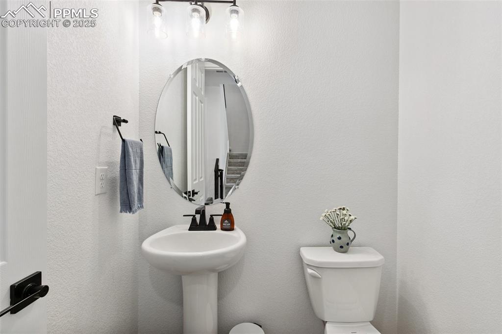 Image 19 of 46: Half bathroom on main level