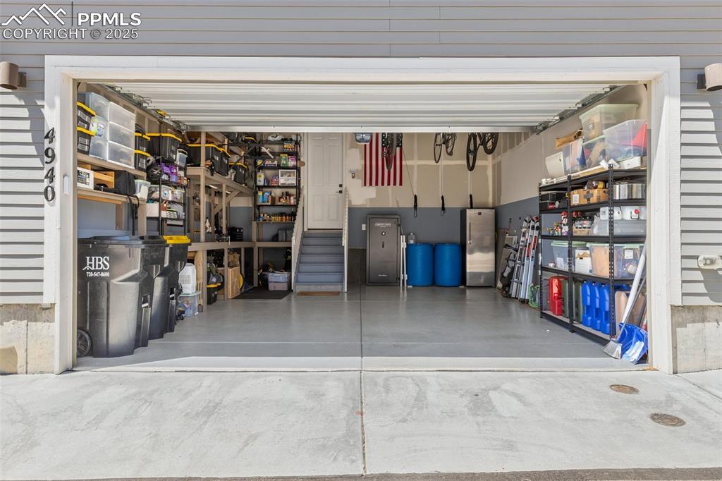 Image 33 of 46: View of garage with built in shelving