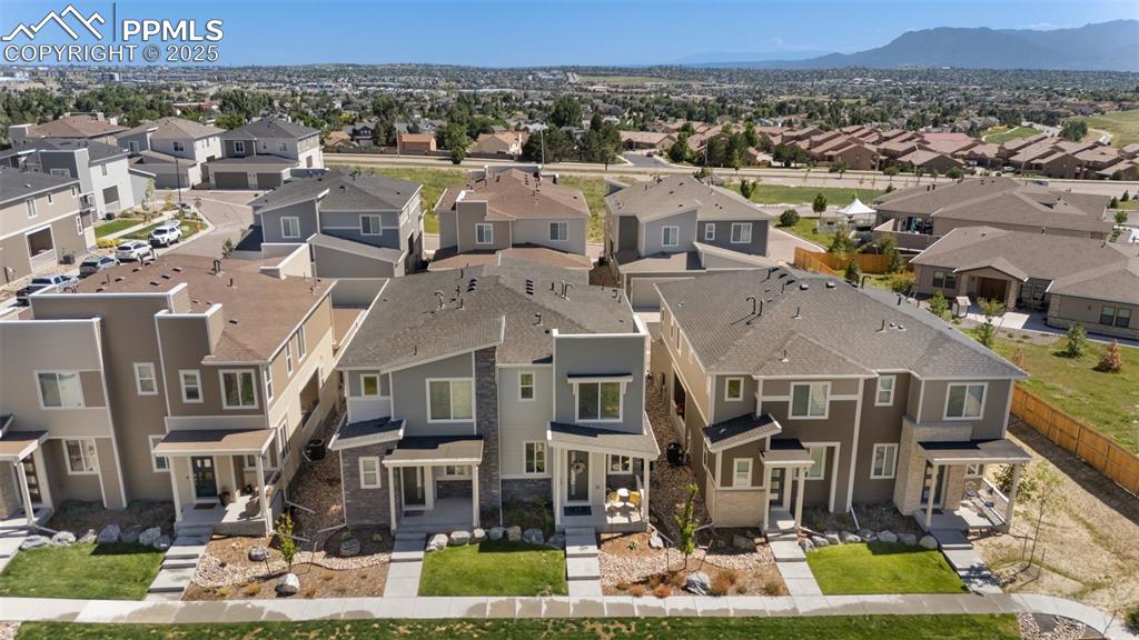 Image 38 of 46: Aerial perspective of suburban area with a mountain backdrop